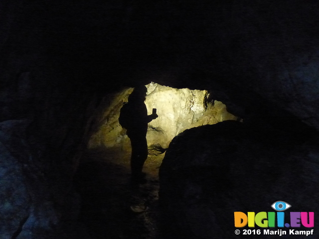 FZ025917 Jenni walking in Carreg Cennen Castle cave